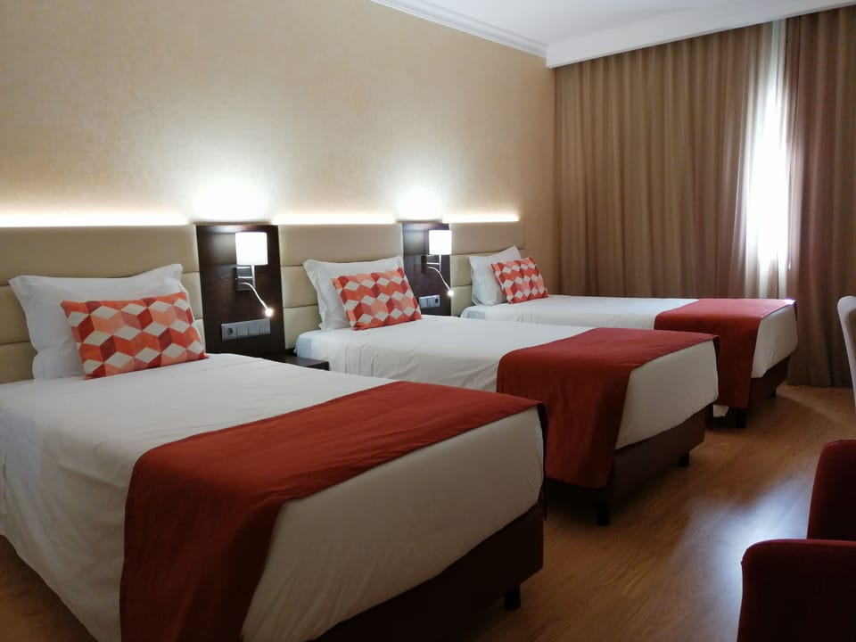 Triple Room | Minibar, in-room safe, desk, soundproofing