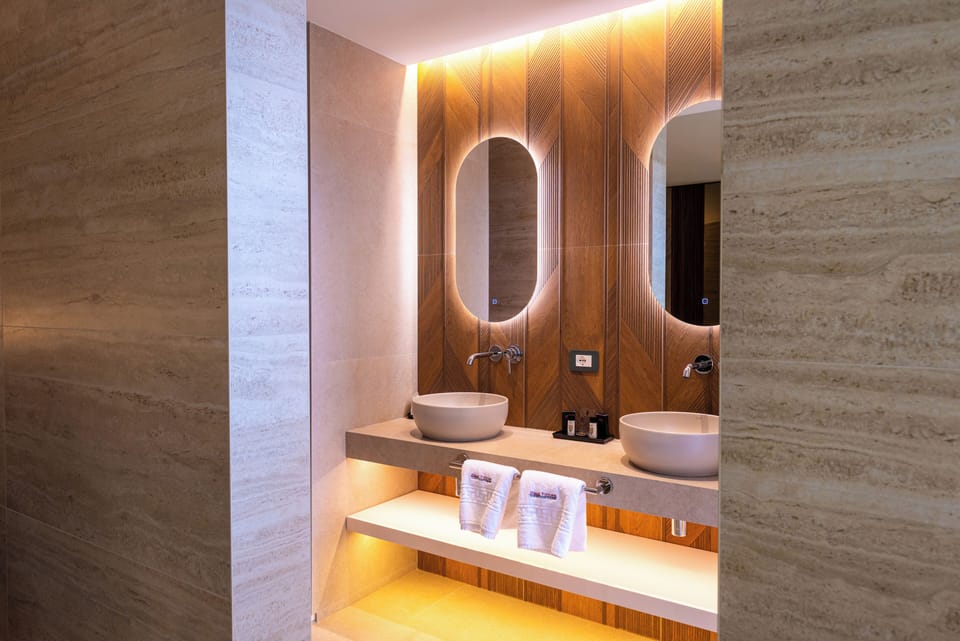 Exclusive Studio Suite, 1 King Bed with Sofa bed, City View, Tower | Bathroom | Designer toiletries, hair dryer, towels, soap