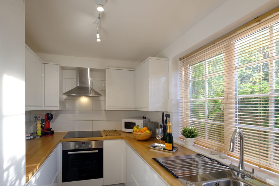 Panoramic Apartment, Private Bathroom (Riverwalk Apartment One) | Shared kitchen | Highchair