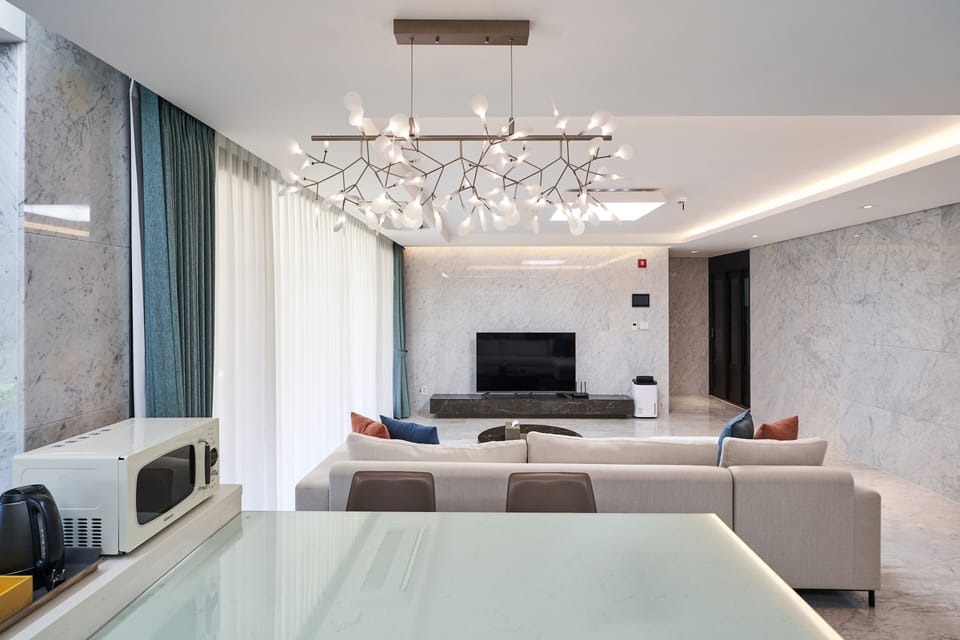 Premium Villa, 3 Bedrooms | Living area | 56-inch LCD TV with cable channels, TV, heated floors