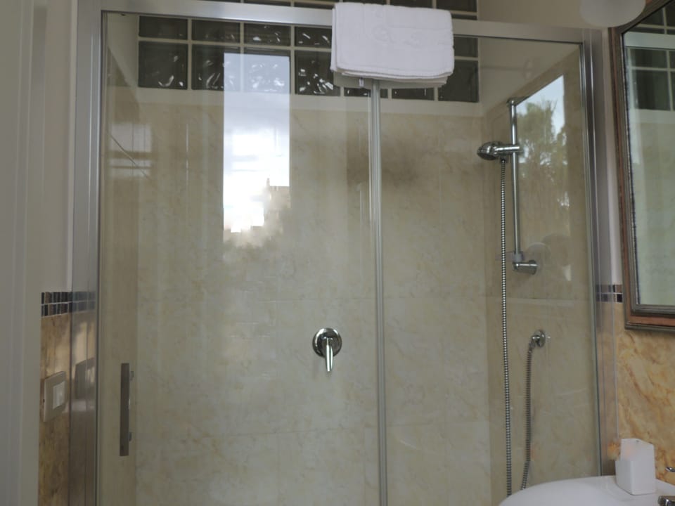 Triple Room, Balcony | Bathroom | Free toiletries, hair dryer, bathrobes, towels