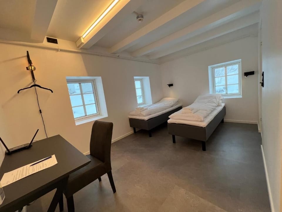 Desk, laptop workspace, free WiFi, bed sheets