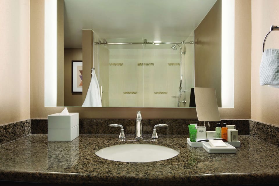 Combined shower/tub, designer toiletries, hair dryer, towels
