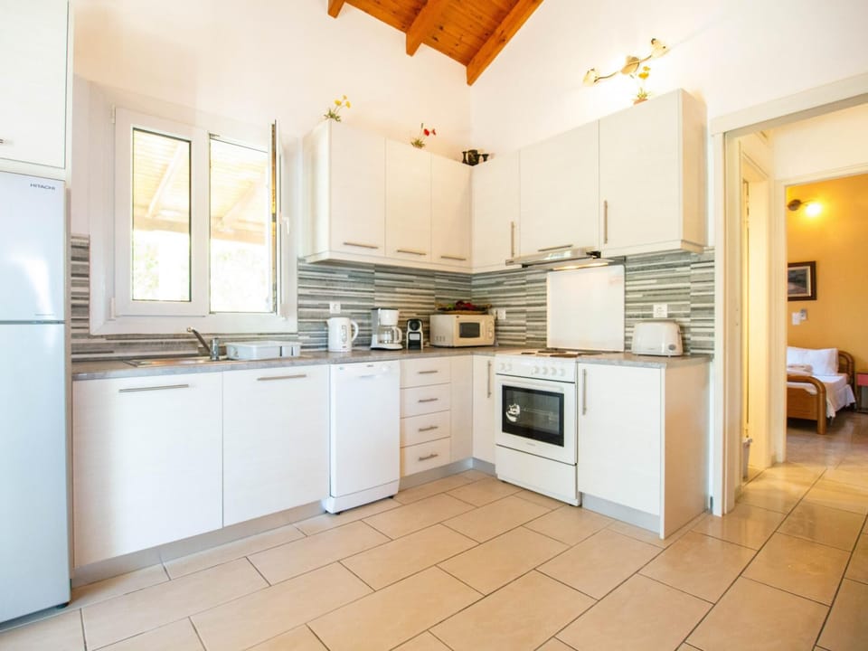 House | Private kitchen | Stovetop, highchair, cookware/dishes/utensils, dining tables