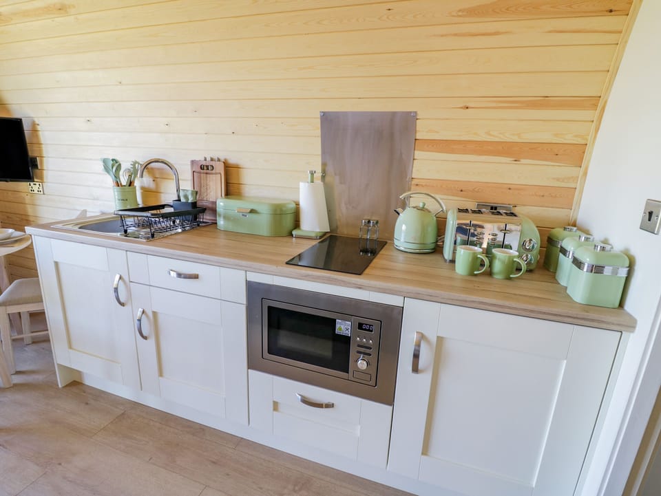 Fridge, electric kettle, toaster, cookware/dishes/utensils
