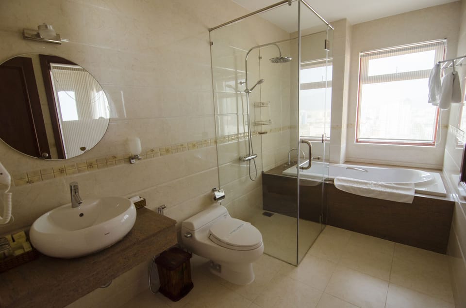 Suite, 1 Double Bed | Bathroom | Shower, hair dryer, slippers, bidet