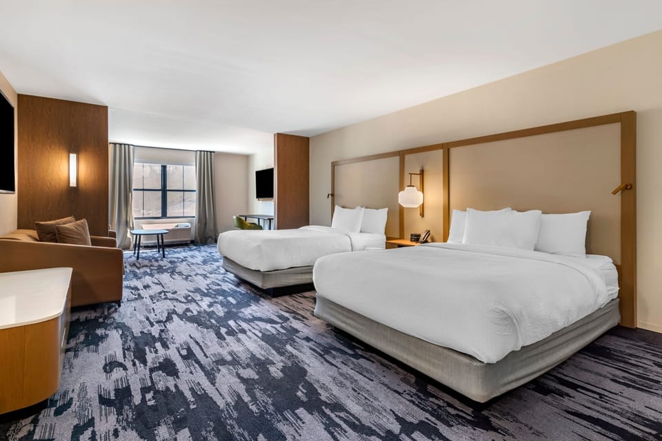 Suite, 2 Queen Beds | Hypo-allergenic bedding, individually decorated, desk, laptop workspace