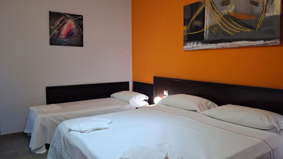 Standard Triple Room | Frette Italian sheets, memory foam beds, individually decorated, desk