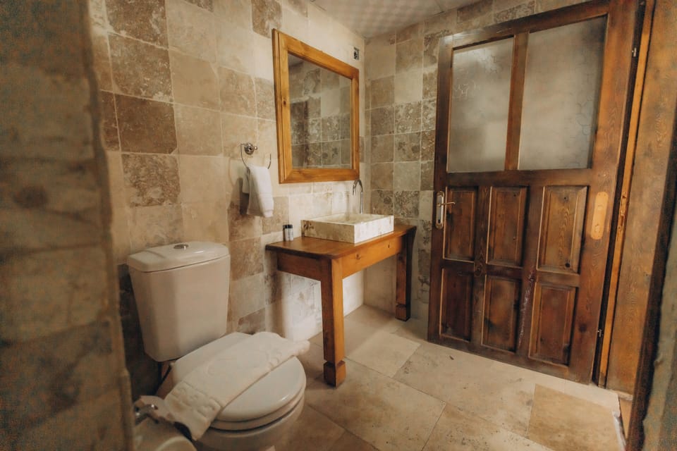 Luxury Triple Room | Bathroom | Shower, rainfall showerhead, designer toiletries, hair dryer