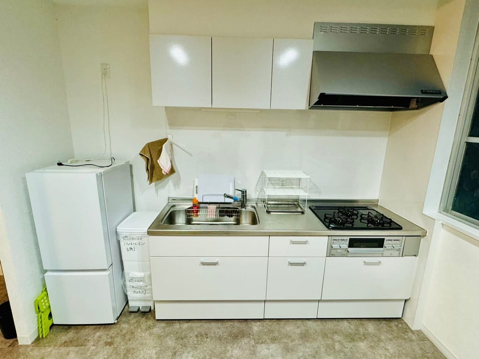 House | Private kitchen | Full-size fridge, stovetop, cookware/dishes/utensils, dining table