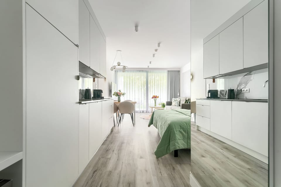 Deluxe Studio | Living area | Flat-screen TV