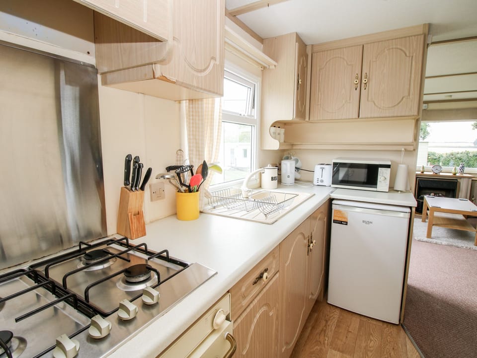 Fridge, electric kettle, toaster, cookware/dishes/utensils