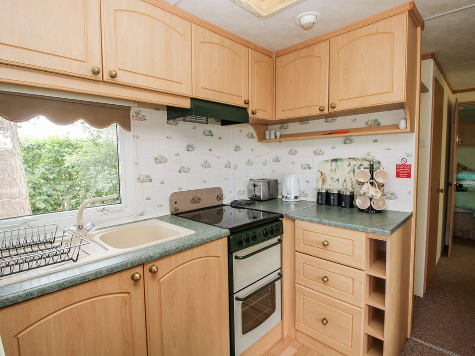 Fridge, electric kettle, toaster, cookware/dishes/utensils