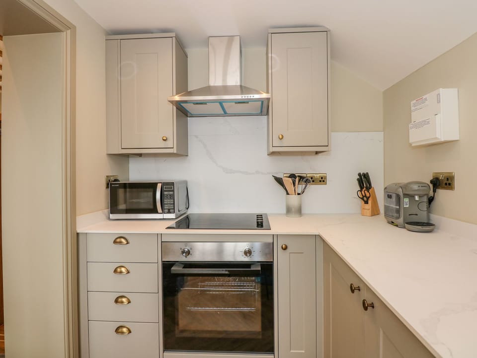 Fridge, electric kettle, toaster, cookware/dishes/utensils