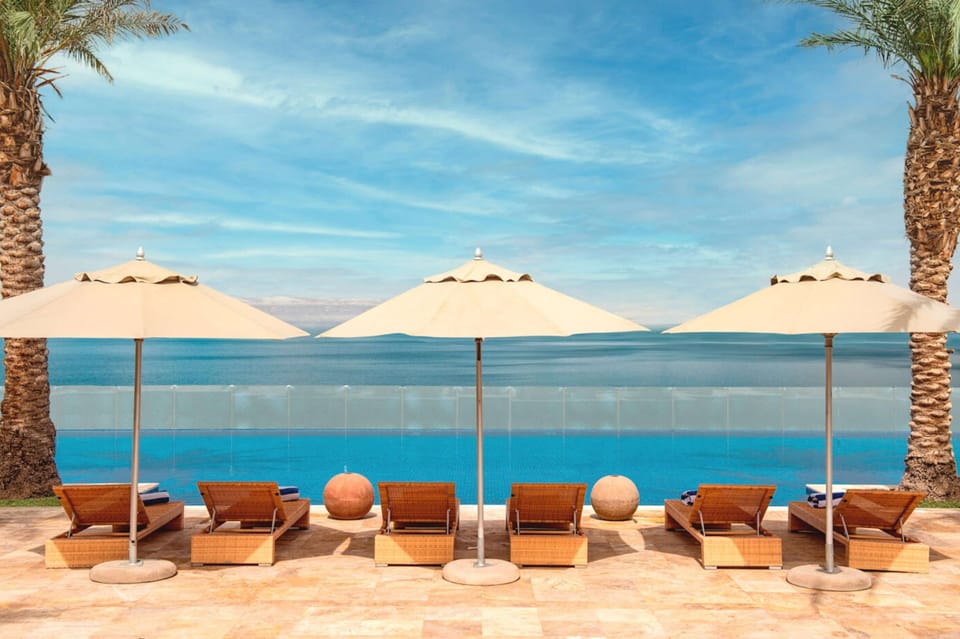 2 outdoor pools, open 7 AM to 7:30 PM, pool umbrellas, sun loungers