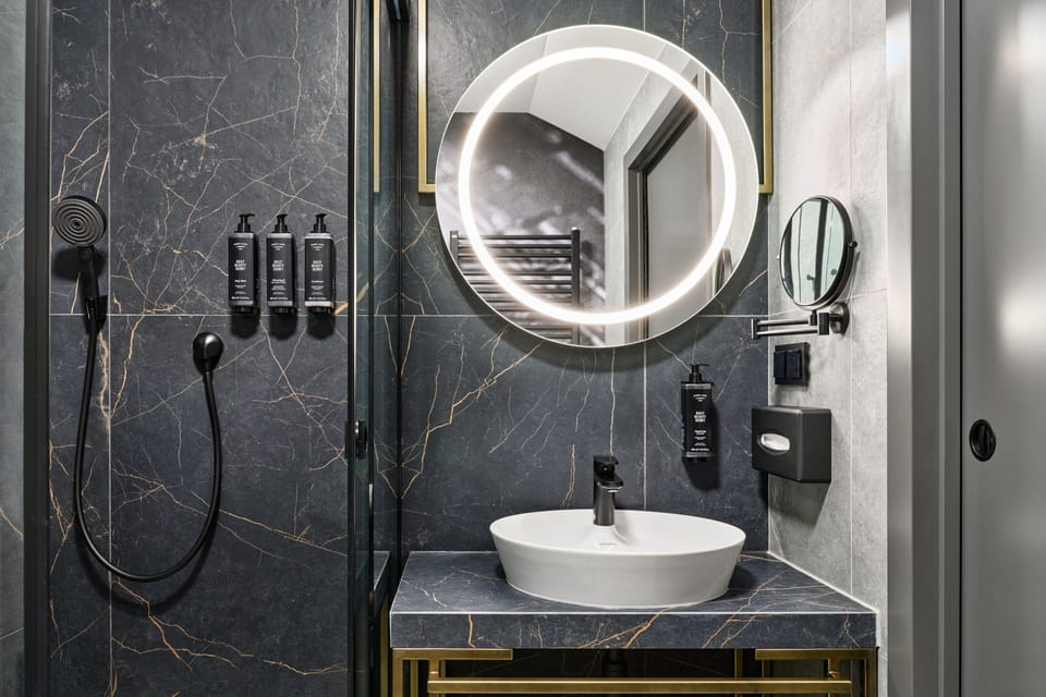 Shower, rainfall showerhead, designer toiletries, hair dryer