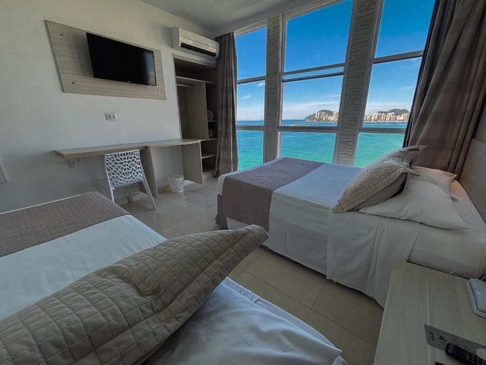 Comfort Triple Room, Beach View | Minibar, WiFi (free), bed sheets