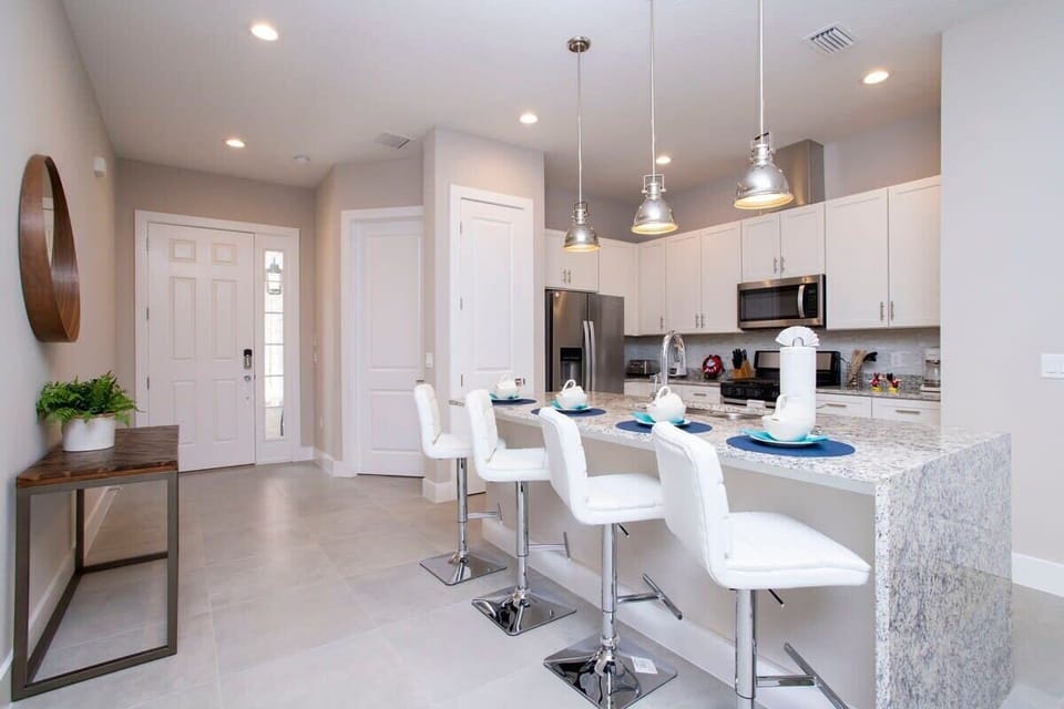 Townhome | Private kitchen | Full-size fridge, microwave, oven, stovetop