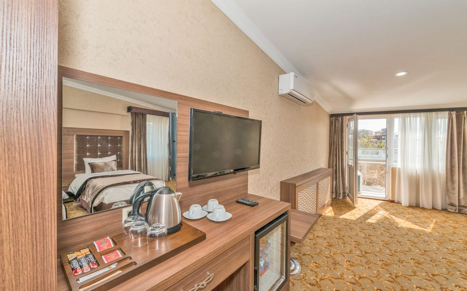 Standard Quadruple Room, Balcony | 1 bedroom, premium bedding, minibar, in-room safe