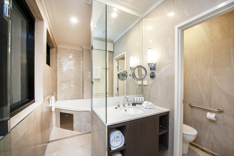 Luxury Suite, 1 Queen Bed, Bathtub | Bathroom | Designer toiletries, hair dryer, towels, soap