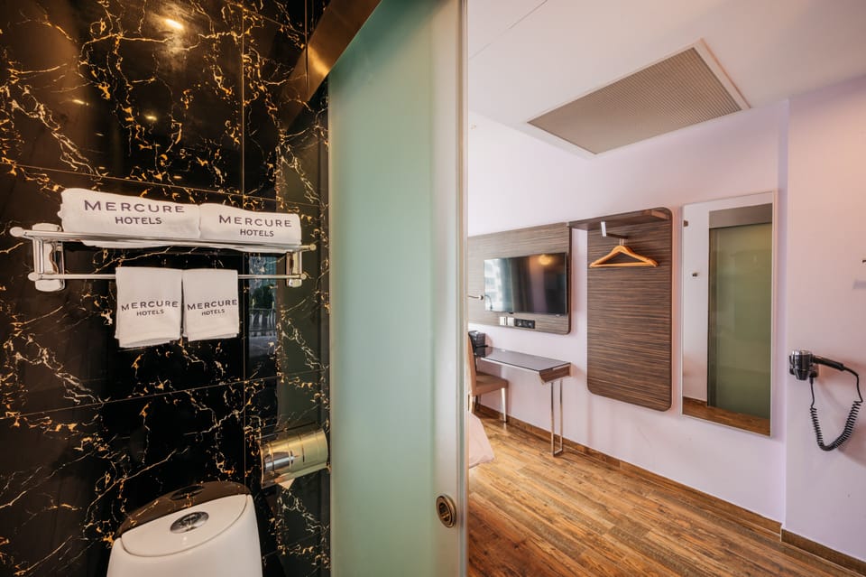 Shower, eco-friendly toiletries, hair dryer, bidet