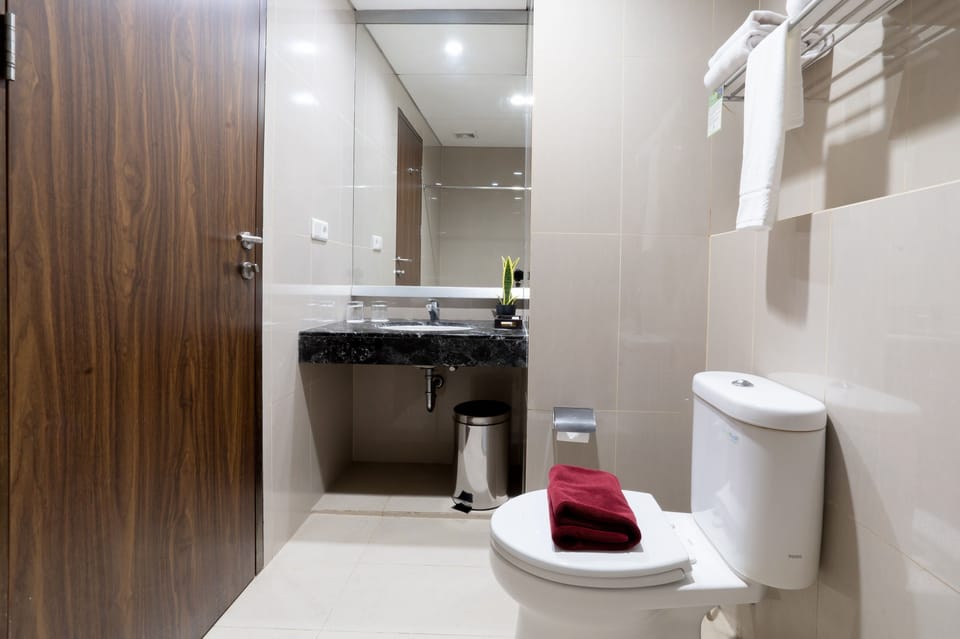Shower, hair dryer, slippers, towels