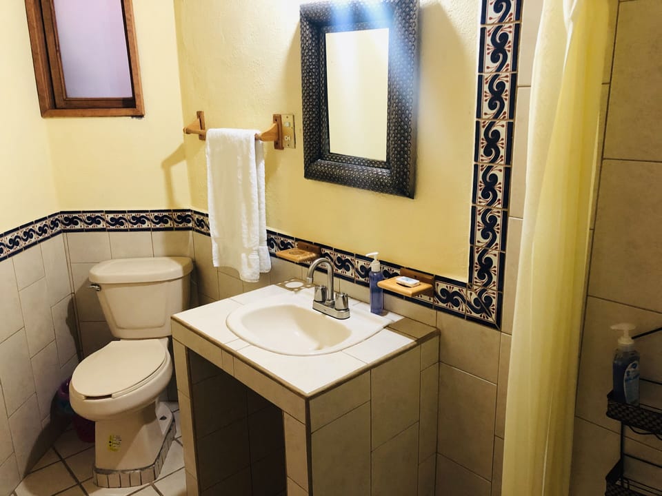 Classic Quadruple Room, Garden View | Bathroom | Shower, towels, soap, shampoo