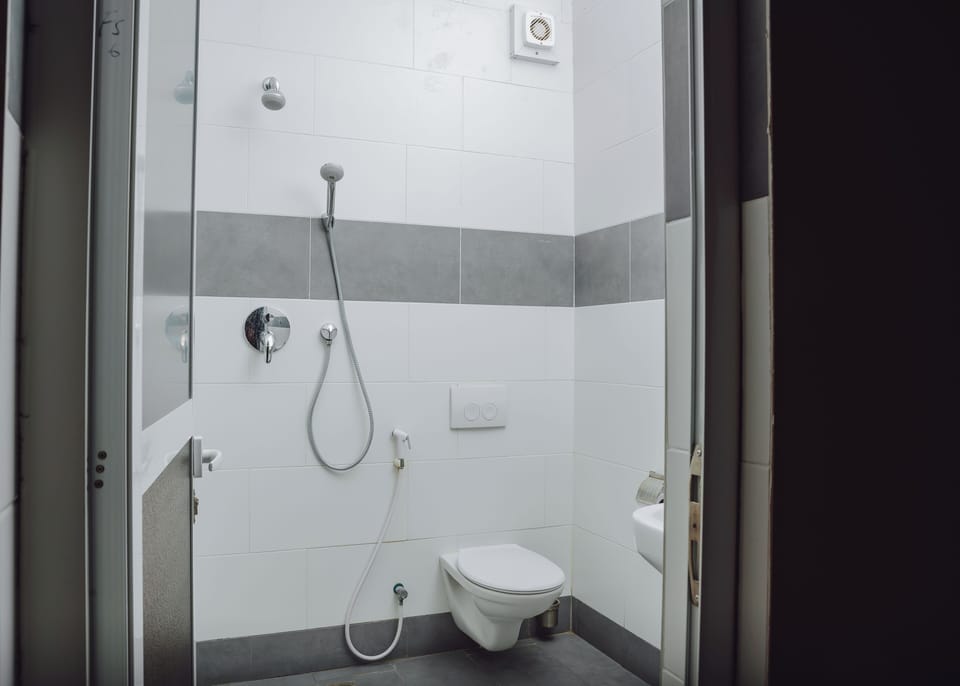 Shower, bathrobes, slippers, towels