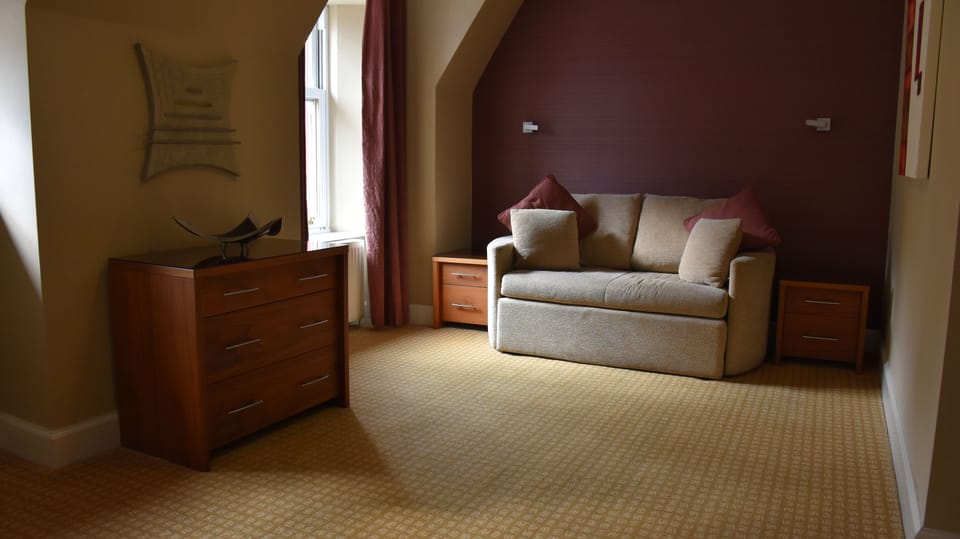 Suite Family Room | Desk, iron/ironing board, free WiFi, bed sheets