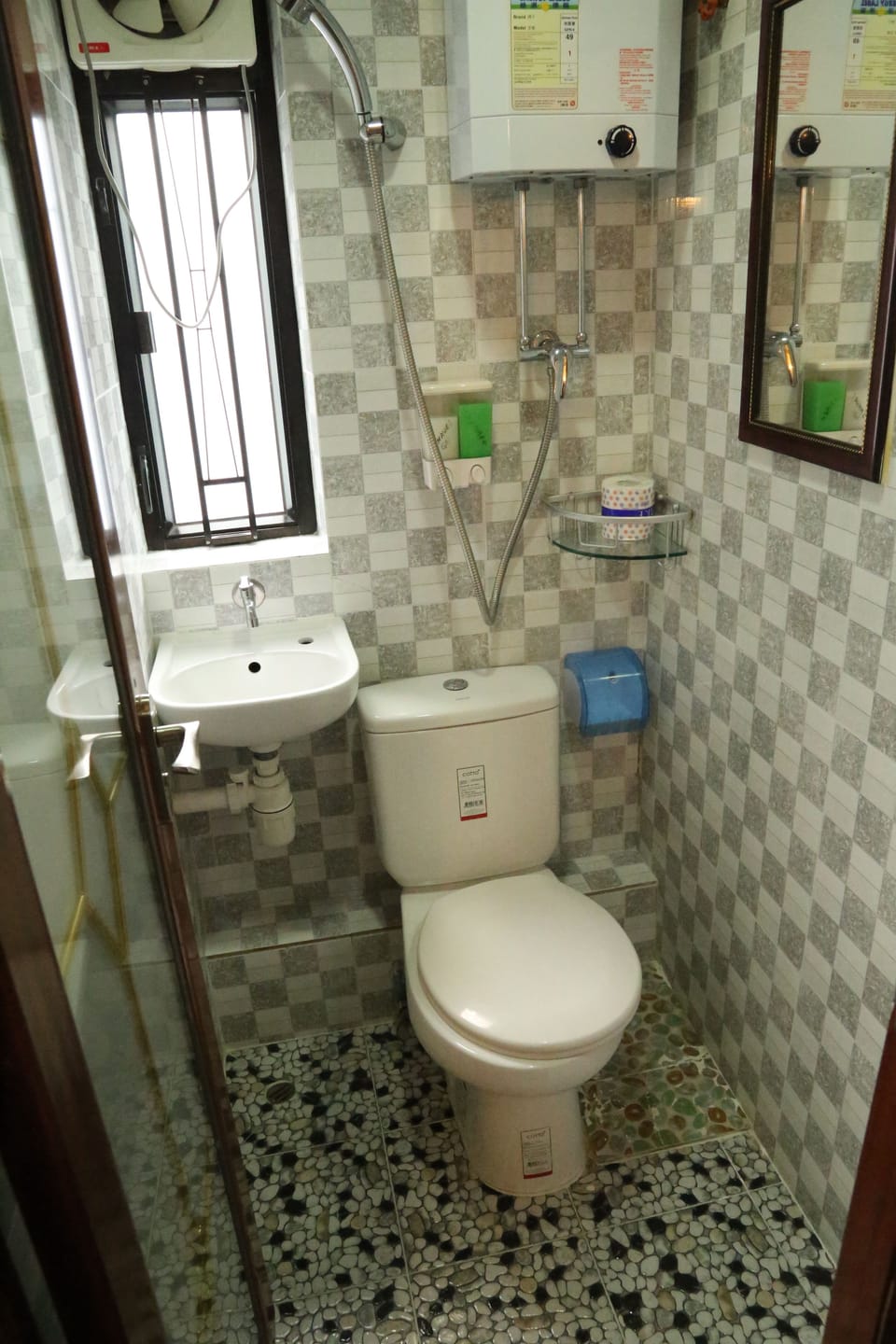 Shower, hair dryer, slippers, towels