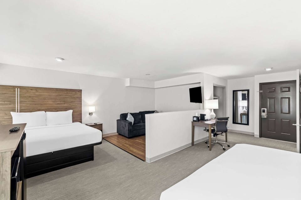 Suite, Multiple Beds, Non Smoking | Pillowtop beds, blackout drapes, iron/ironing board, rollaway beds