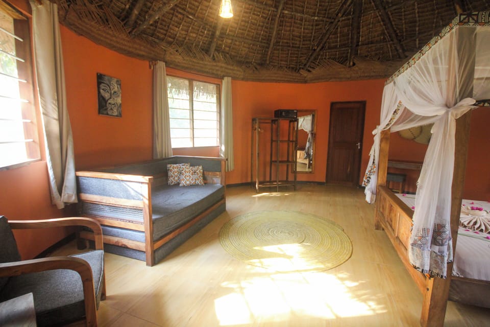 Banda Bungalo | Down comforters, memory foam beds, in-room safe, blackout drapes