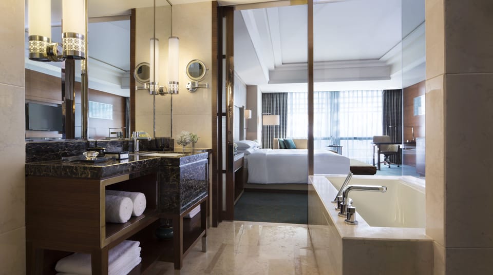 Executive Room, 1 King Bed | Bathroom | Separate tub and shower, free toiletries, hair dryer, bathrobes