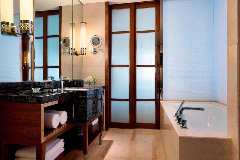 Separate tub and shower, free toiletries, hair dryer, bathrobes