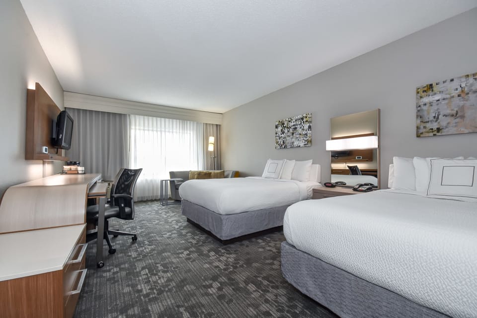 Premium bedding, down comforters, in-room safe, desk