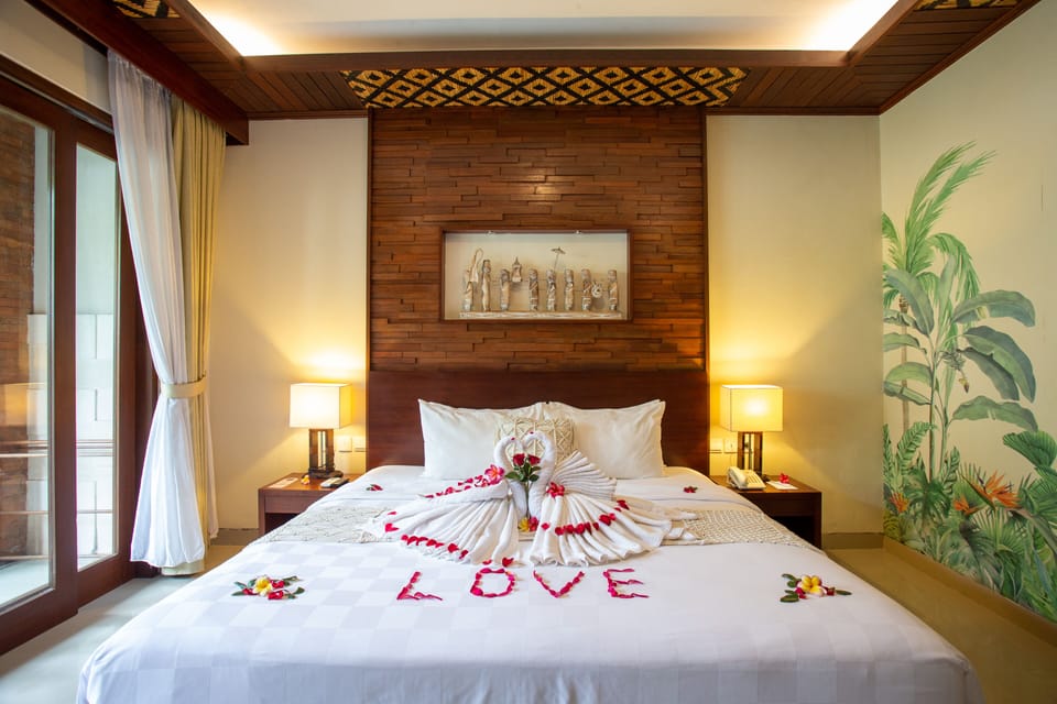 Super Deluxe Pool View | Minibar, in-room safe, desk, iron/ironing board