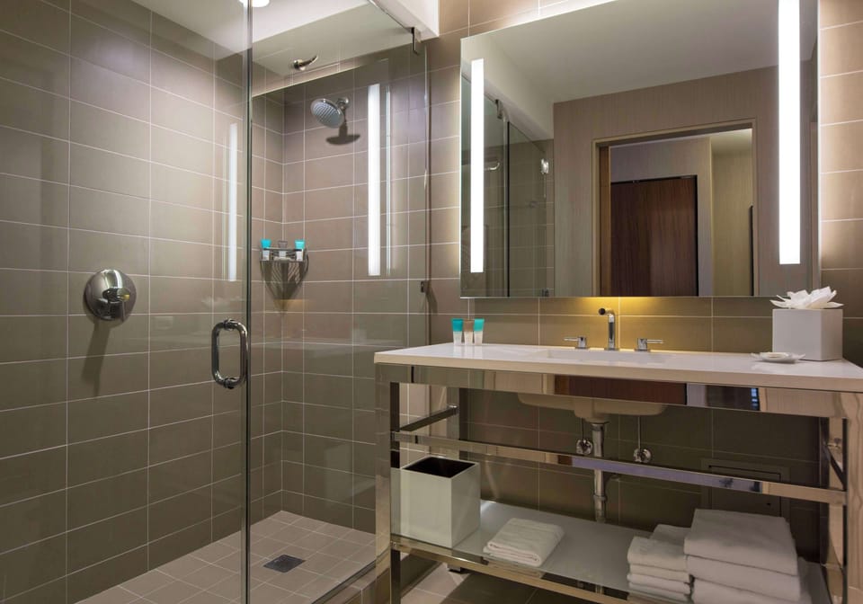 Designer toiletries, hair dryer, bathrobes, towels