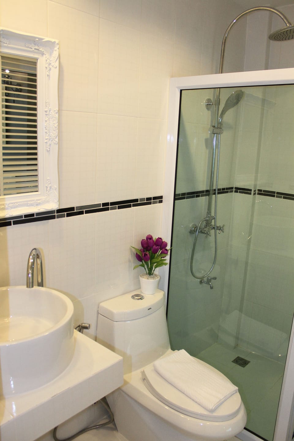 Shower, free toiletries, hair dryer, slippers