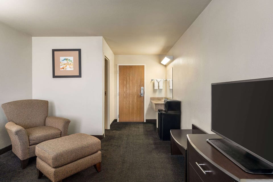 Desk, blackout drapes, iron/ironing board, free rollaway beds