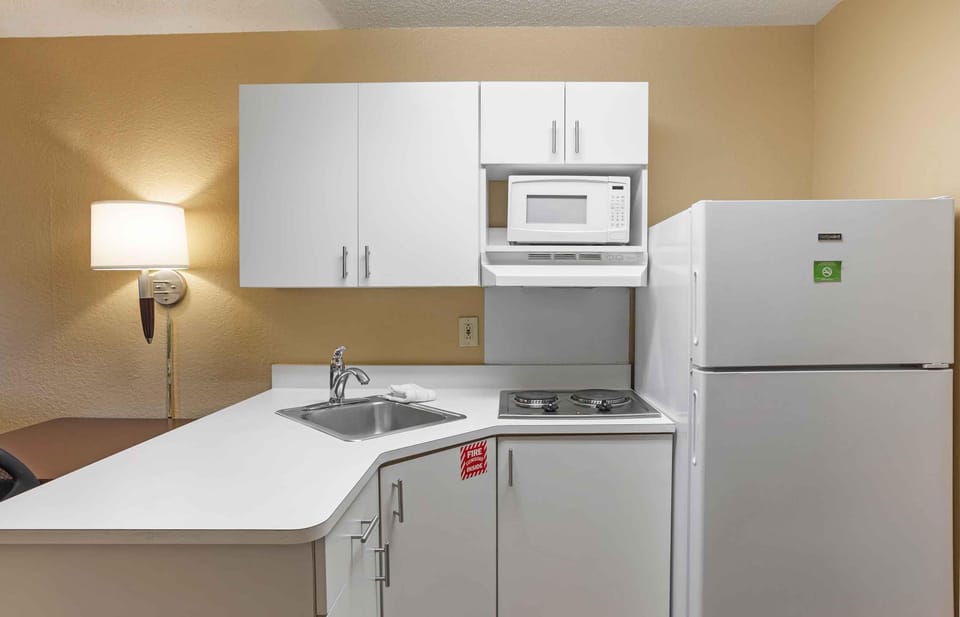 Studio, 1 Queen Bed, Non Smoking | Private kitchen | Full-size fridge, microwave, stovetop, coffee/tea maker