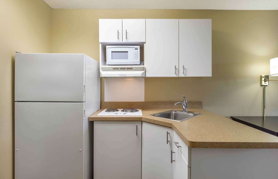 Studio, 1 King Bed, Non Smoking | Private kitchen | Full-size fridge, microwave, stovetop, coffee/tea maker