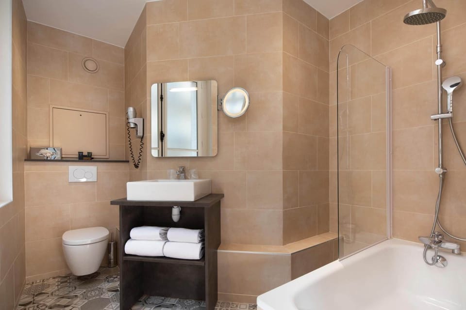 Eco-friendly toiletries, hair dryer, bathrobes, towels