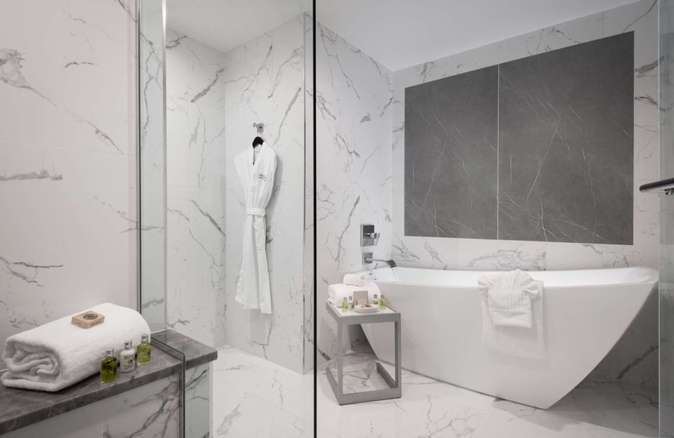 Royal Suite | Bathroom | Designer toiletries, hair dryer, bathrobes, towels
