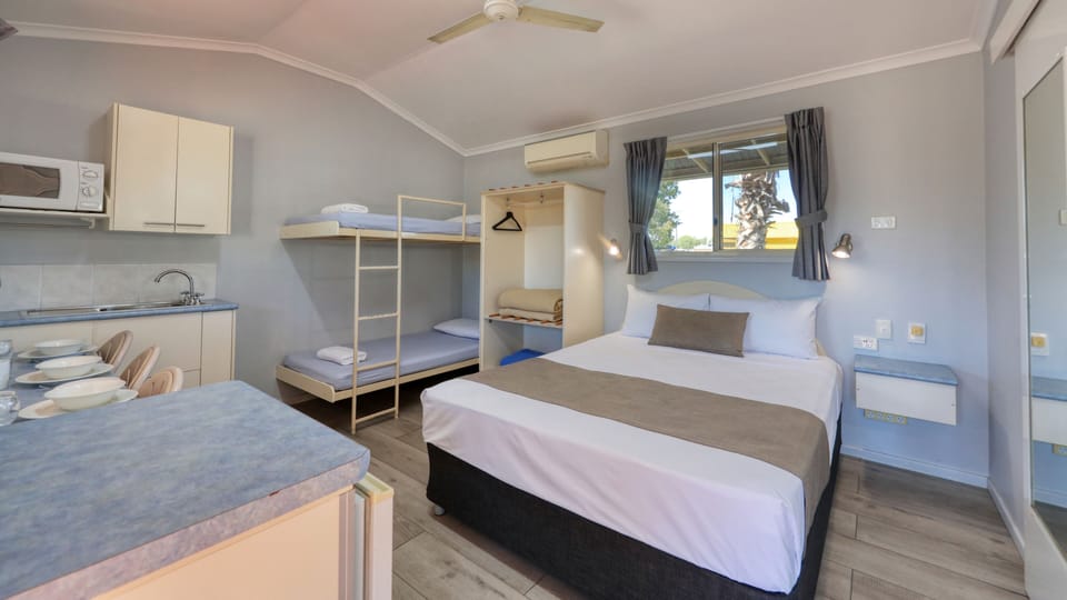 Blackout drapes, iron/ironing board, WiFi (free), bed sheets