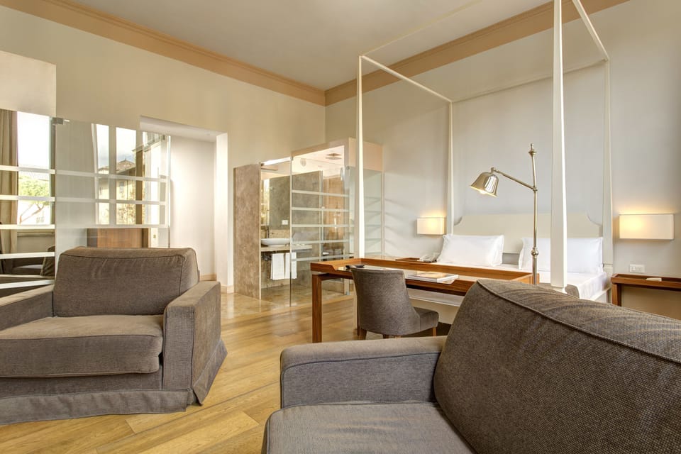 Junior Suite, Garden View | Minibar, in-room safe, desk, blackout drapes