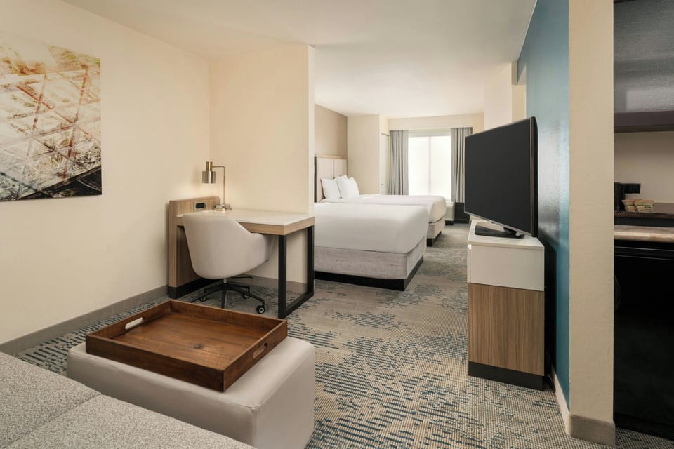 Premium bedding, down comforters, pillowtop beds, in-room safe