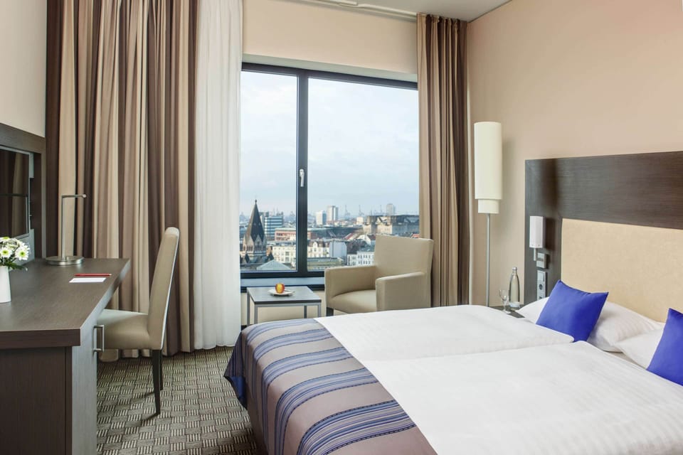 Hypo-allergenic bedding, minibar, in-room safe, desk