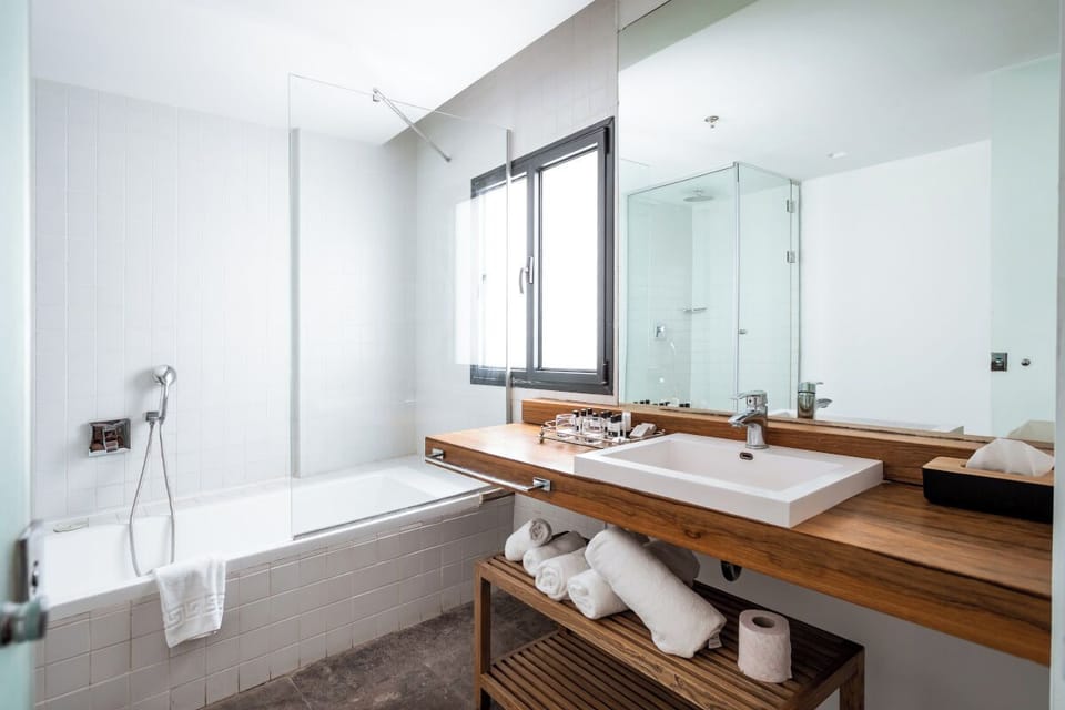 Separate tub and shower, free toiletries, hair dryer, bathrobes