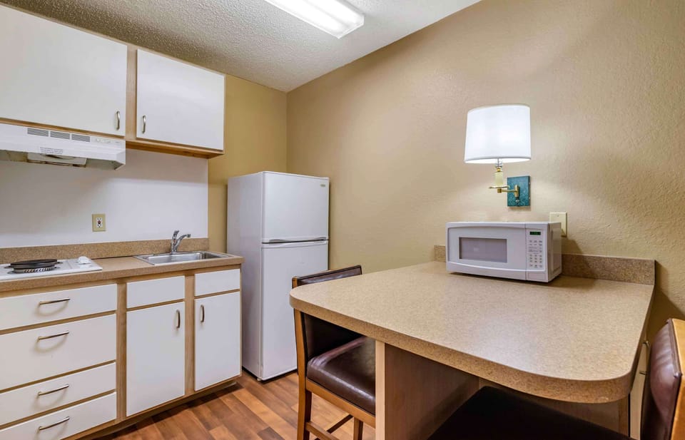 Studio, 1 Queen Bed, Non Smoking | Private kitchen | Full-size fridge, microwave, stovetop