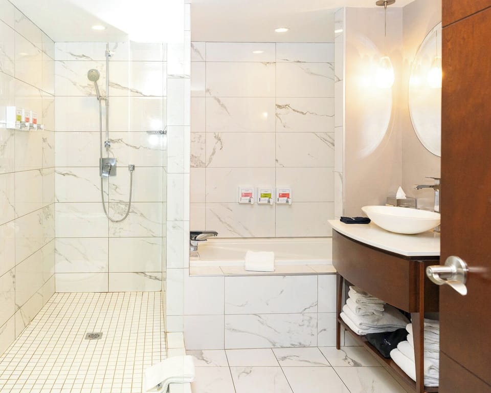 Combined shower/tub, designer toiletries, hair dryer, bathrobes